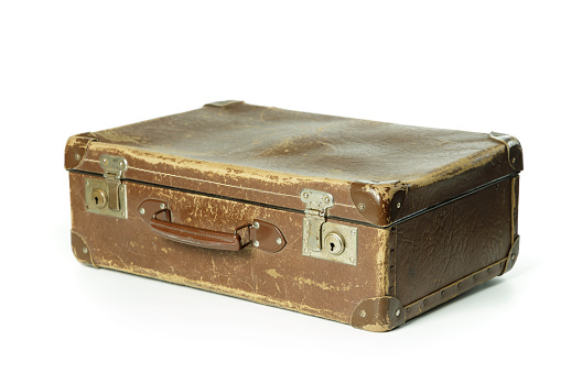 A closeup shot of an old leather suitcase isolated on white background