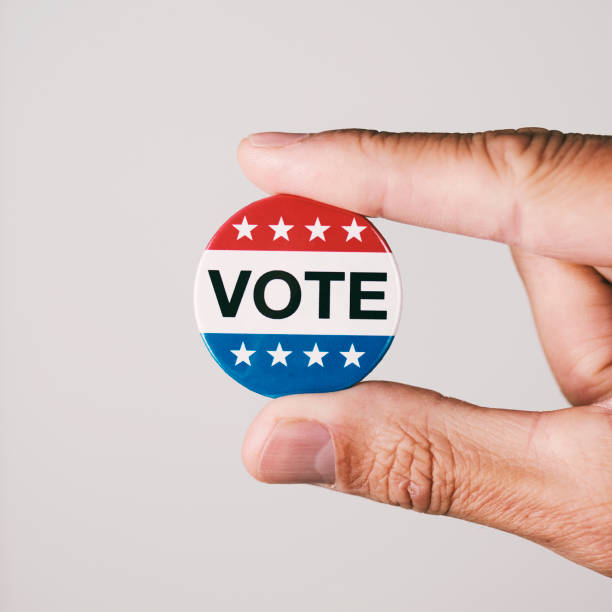 istock man with a vote badge for the US election 1278750647