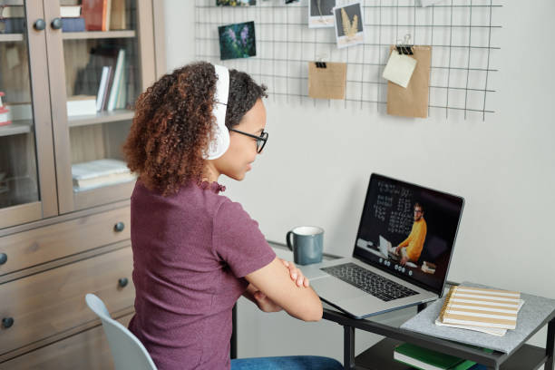 istock Young mixed-race diligent student having online lesson in home environment 1278751053