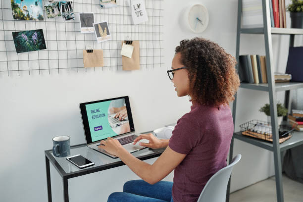 istock Young mixed-race student in eyeglasses and casualwear taking online course 1278751078