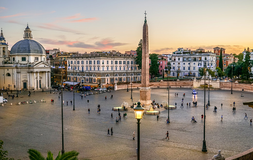 Rome, Italy, September 29 -- A view of the iconic Piazza del Popolo from the Pincio Gardens viewpoint, in the Villa Borghese. In neoclassical style, Piazza del Popolo it was the work of the Roman architect Giuseppe Valadier, who in the early 1800s redesigned the entire square. Villa Borghese its the green heart of Rome where citizens and tourists come to spend hours of relaxation and silence among avenues, ponds and gardens immersed in the green of ancient trees. Image in High Definition format.