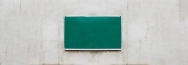 empty schoolboard or chalkboard on concrete wall, school background, education banner with copy space