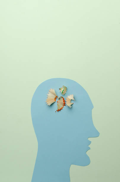 istock Vertical image.Paper blue head and pencil shavings.Vertical image.Empty space.Mental health 1278753165