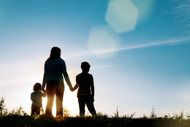 istock mother with kids walk in sunset nature 1278753934