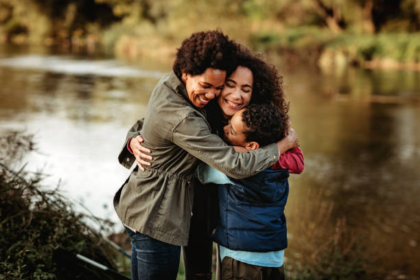 istock Black mother hugging her kids 1278754955