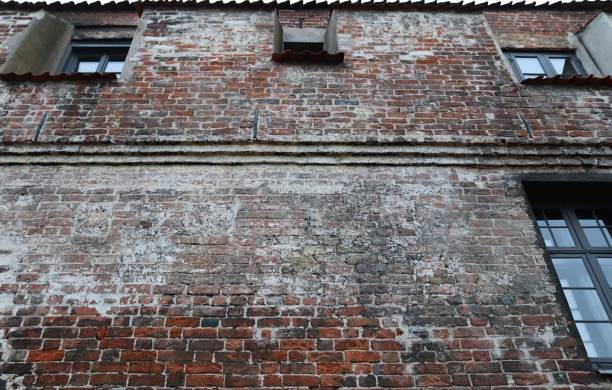 istock Old brick wall. Texture of old weathered brick wall panoramic background 1278756404