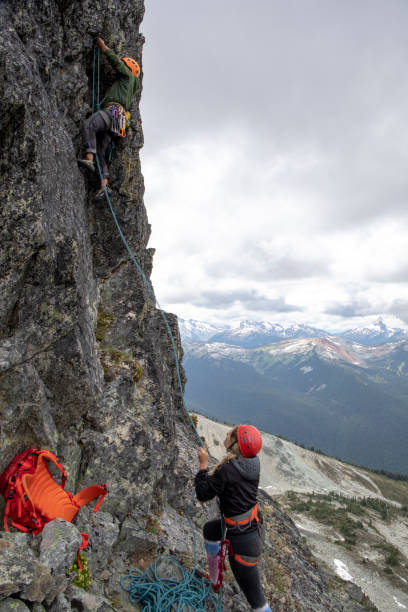 istock Mountaineer climbs up mountain ridge 1278756425