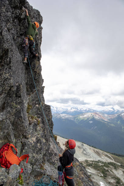 istock Mountaineer climbs up mountain ridge 1278756434