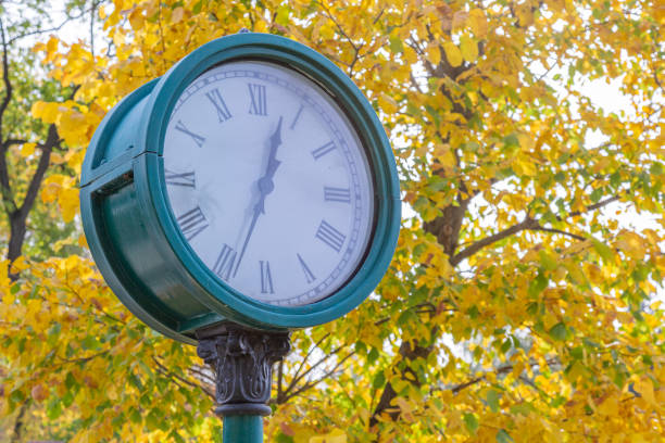 istock Big round clock in autumn park 1278756717
