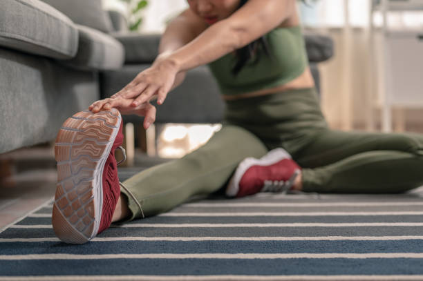 istock A woman stretching , she warming up for a workout session 1278758164
