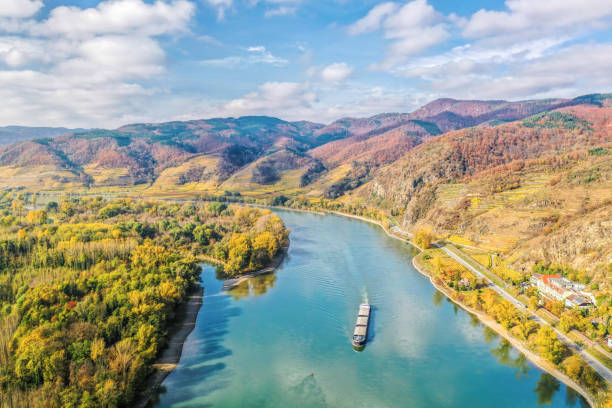 Panorama of Wachau valley with ship on Danube river during autumn in Austria Panorama of Wachau valley with ship on Danube river during autumn in Austria blue danube stock pictures, royalty-free photos & images
