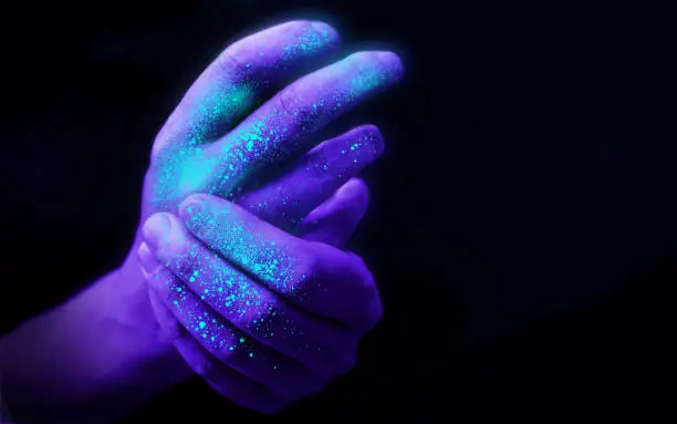 Photo of Washing Hands in Ultra Violet Light