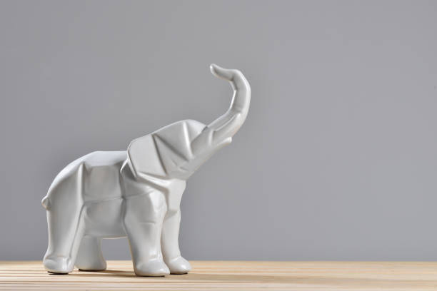 istock White elephant statues in geometry style with a copy space 1278759243