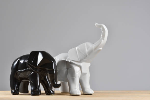 istock Figurines of elephants on a gray background with copy space 1278760275