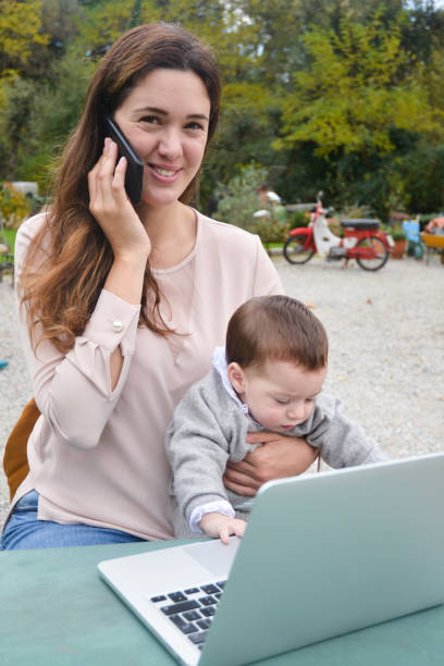 istock Working mother with her baby 1278762206