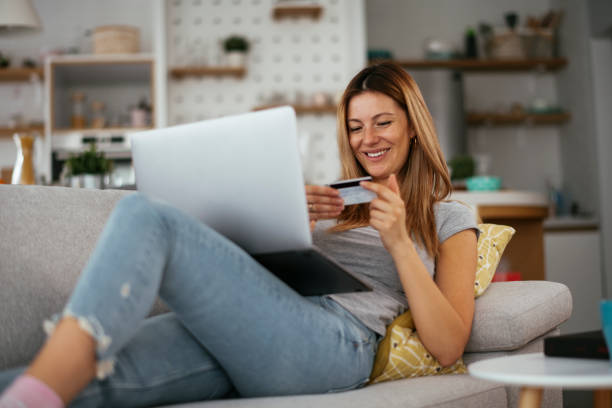 istock Young businesswoman at home makes a purchase on the Internet. 1278763564