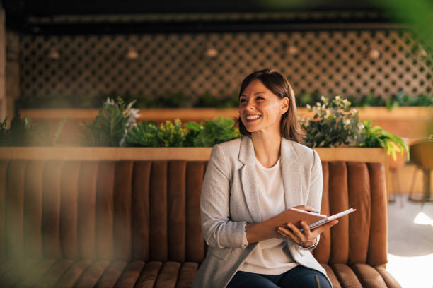 istock Woman sitting at cafe. 1278764984