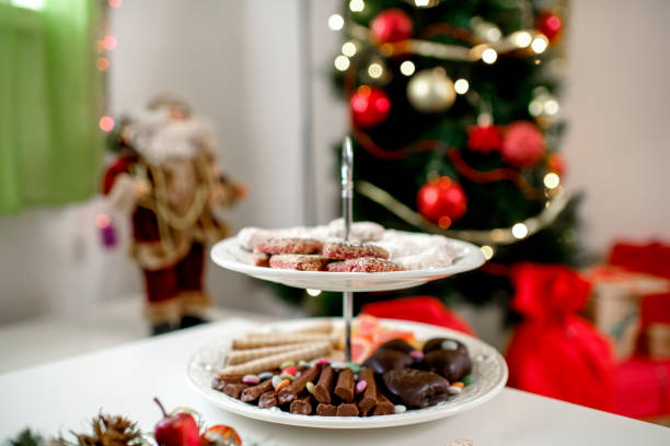 Classic Taiwanese malt cookies featuring crispy wafer biscuits sandwiched with soft chewy malt syrup filling. Traditional confection showcasing golden-brown color and layered texture on serving plate.