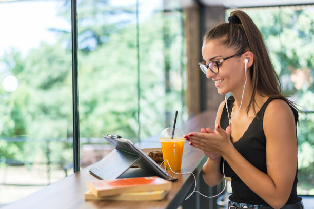 istock A woman in a cafe uses a tablet. 1278765639
