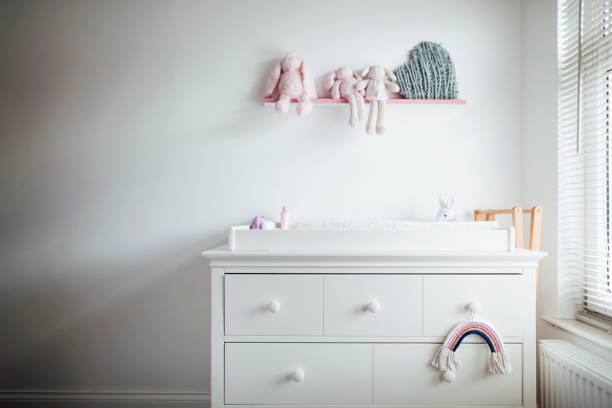 A modern baby girl's nursery bedroom interior.