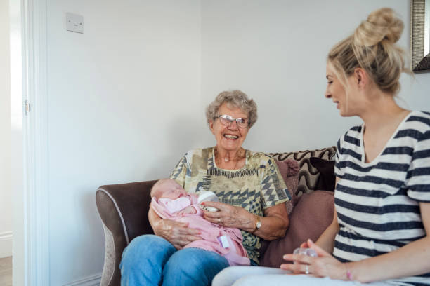 feeding her great granddaughter - great grandchild imagens e fotografias de stock