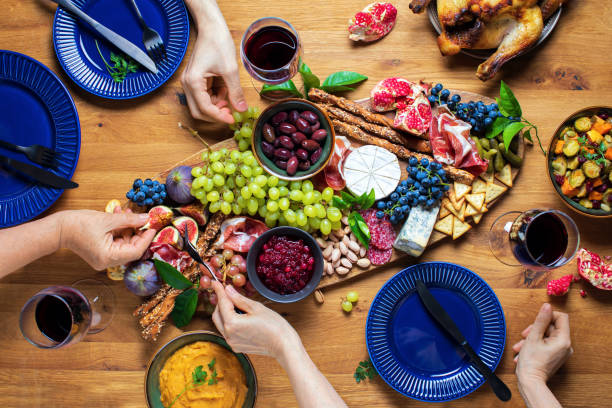 istock Thanksgiving dinner party with charcuterie board, overhead view 1278768140