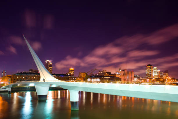 Bridge named Puente de La Mujer, and city skyline at Puerto Madero in Buenos Aires. Buenos Aires, Argentina, South America - November 19, 2018: Bridge named Puente de La Mujer, and city skyline at Puerto Madero, Capital Federal puente de la mujer stock pictures, royalty-free photos & images