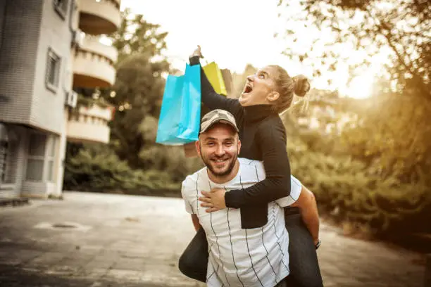 Photo of Happy couple shopping together and having fun