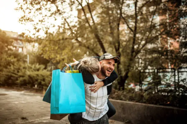 Photo of Happy couple shopping together and having fun
