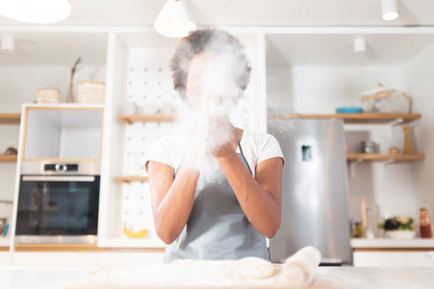 istock Woman having fun with flour in kitchen 1278771247