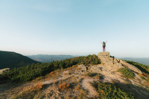 istock Woman hiking in mountains 1278772300