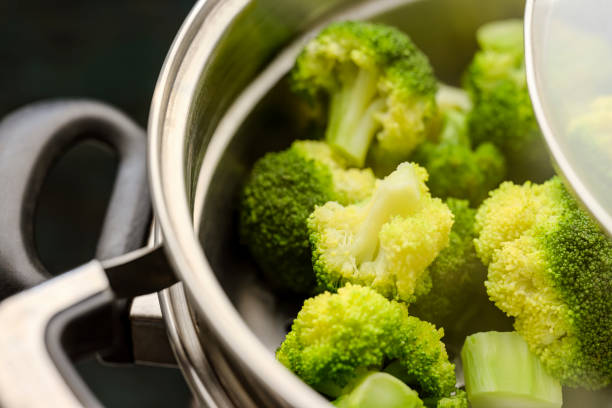 istock Freshly steamed broccoli in a stainless steel steamer combination pot. 1278773867
