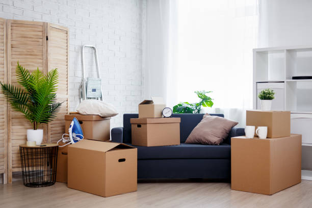 istock moving day - stack of cardboard boxes with belongings in new house 1278774967