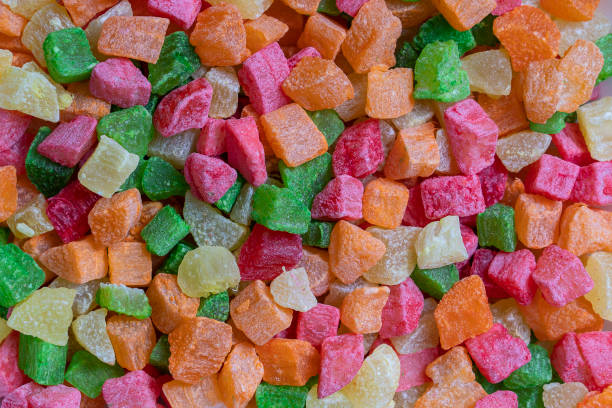 istock Background candied colorful fruit. Dried pineapple bits. Colored dried tropical fruit. Close up 1278775223