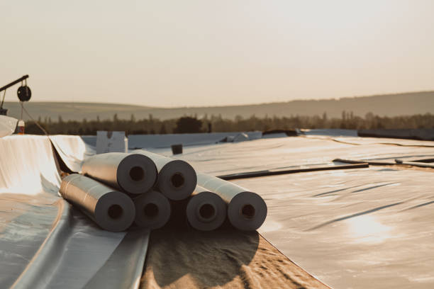 Roofing PVC membrane in rolls placed on the roof of a hall.Rubber membrane ready. Roofing PVC membrane in rolls placed on the roof of a hall.Rubber membrane ready. pvc photos stock pictures, royalty-free photos & images