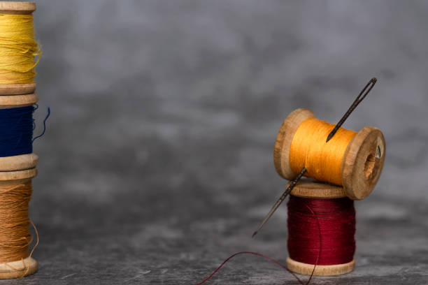 istock Different colorful cotton mill on grey background 1278775853