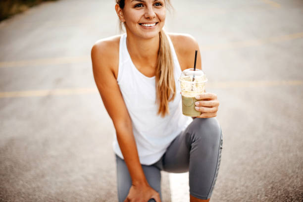 Women drinking smoothie on court