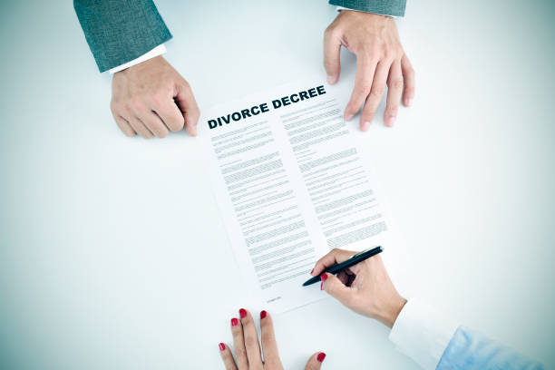 istock young woman signing a divorce decree document 1278776771