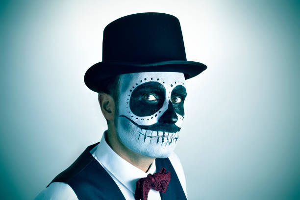 istock man with mexican calaveras makeup, vignetted 1278776813