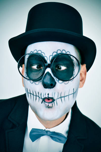 istock man with calaveras makeup wearing eyeglasses and squinting 1278776855
