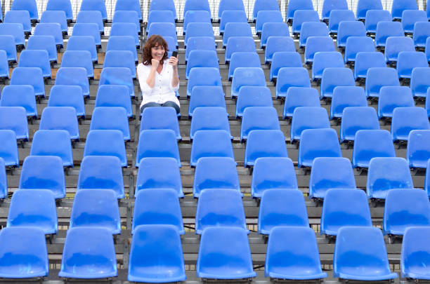 istock Lone middle-aged woman in a stands 1278777537
