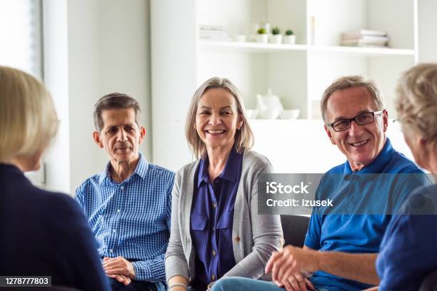 Senior People During Group Therapy Stock Photo - Download Image Now - Meeting, UK, Community Center