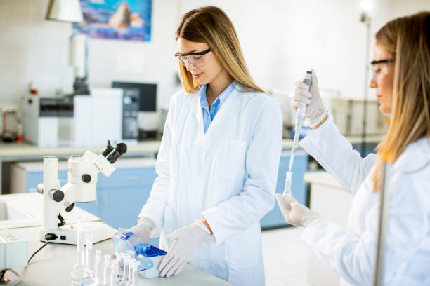 istock Female researchers in white lab coat working in the laboratory 1278777979