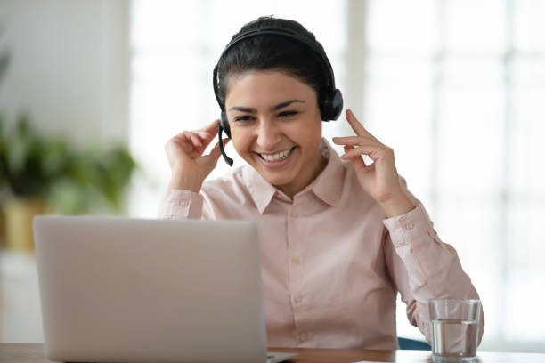 istock Smiling young indian female employee talk on video call 1278778751