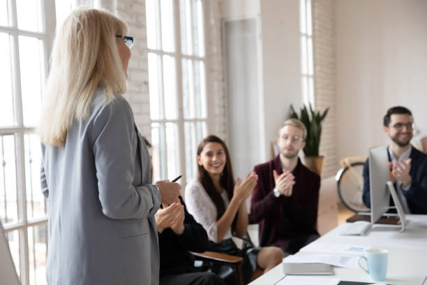istock Excited employee applaud female coach for presentation 1278778809