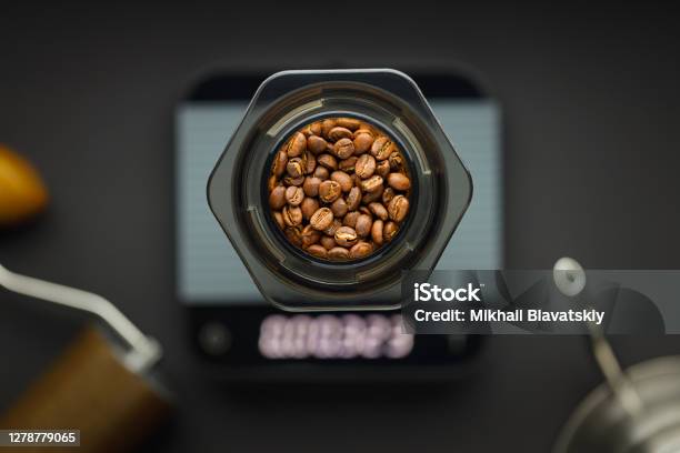 Aeropress Coffee Maker With Scales Coffee Grinder And Kettle On A Black Background Top View Stock Photo - Download Image Now