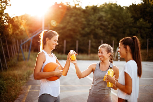 We are ready Group of woman preparing for training outdoor asphalt basketball court stock pictures, royalty-free photos & images