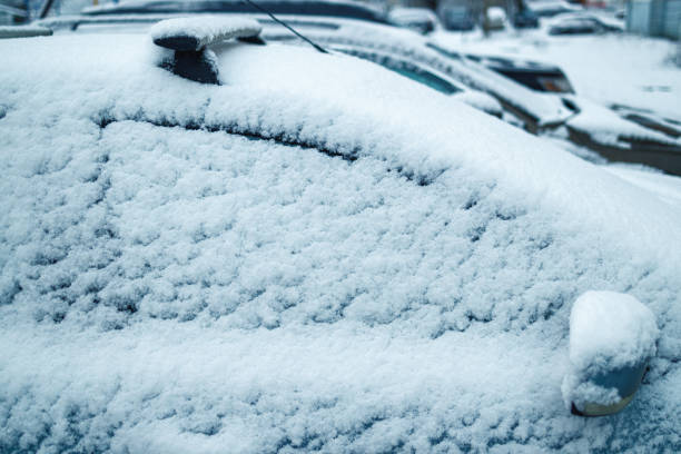 istock Car covered snow, frozen car side window in winter. 1278779218