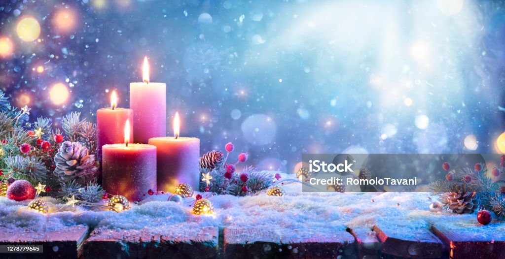 Advent - Four Purple Candles With Christmas Ornament In Shiny Night Four Purple Candles With Bokeh In Shiny Background Christmas Stock Photo