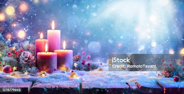 Advent Four Purple Candles With Christmas Ornament In Shiny Night Stock Photo - Download Image Now